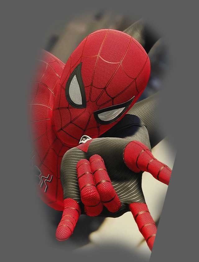 A close up of a spider man holding something in his hand