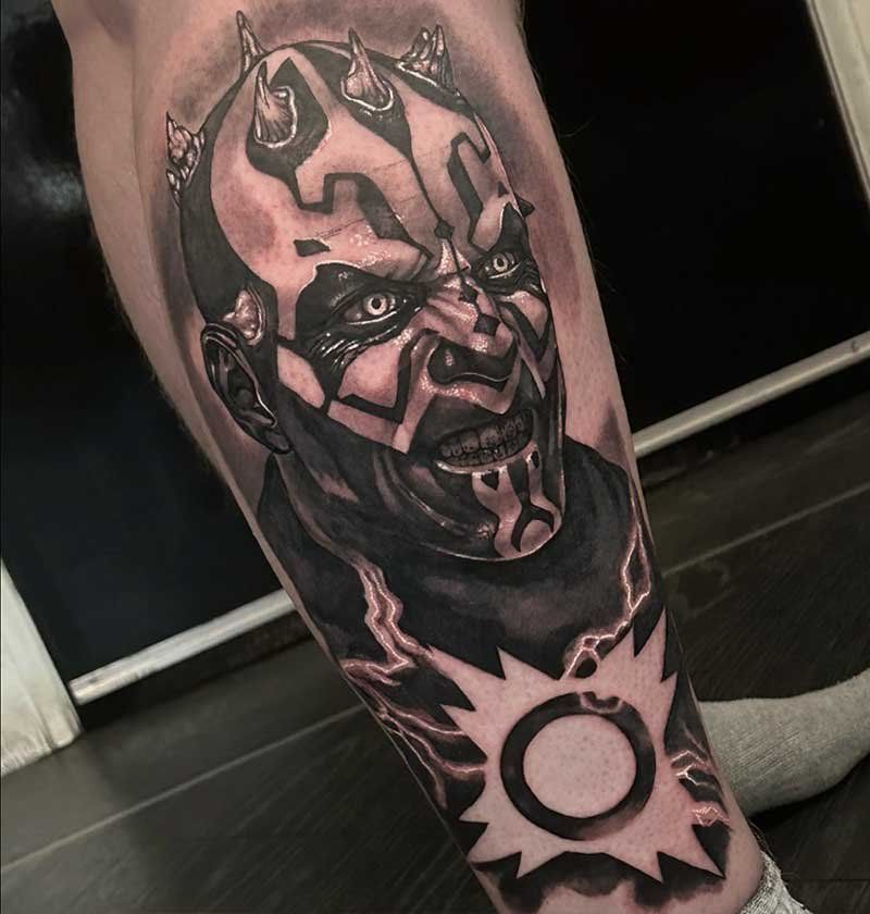 A person has a tattoo of darth maul on their leg